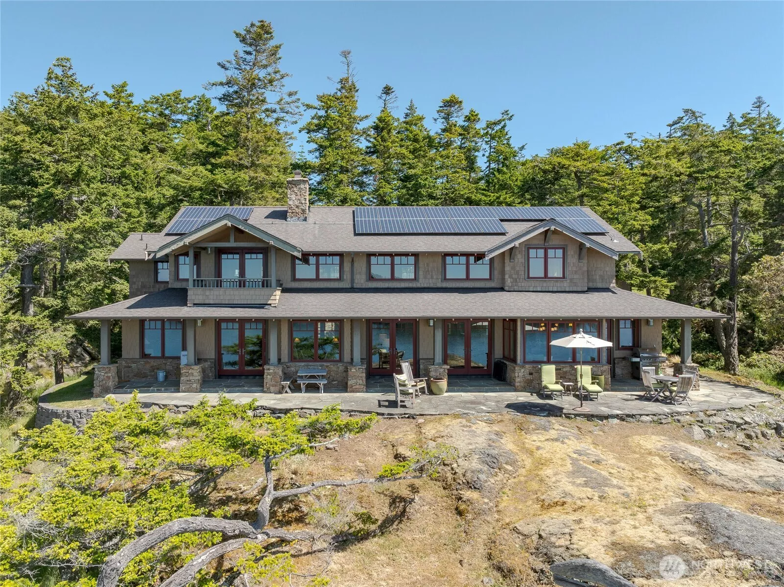 This custom NW Craftsman sits on 27 waterfront acres with southern, territorial views all the way to the Olympic Mountains.