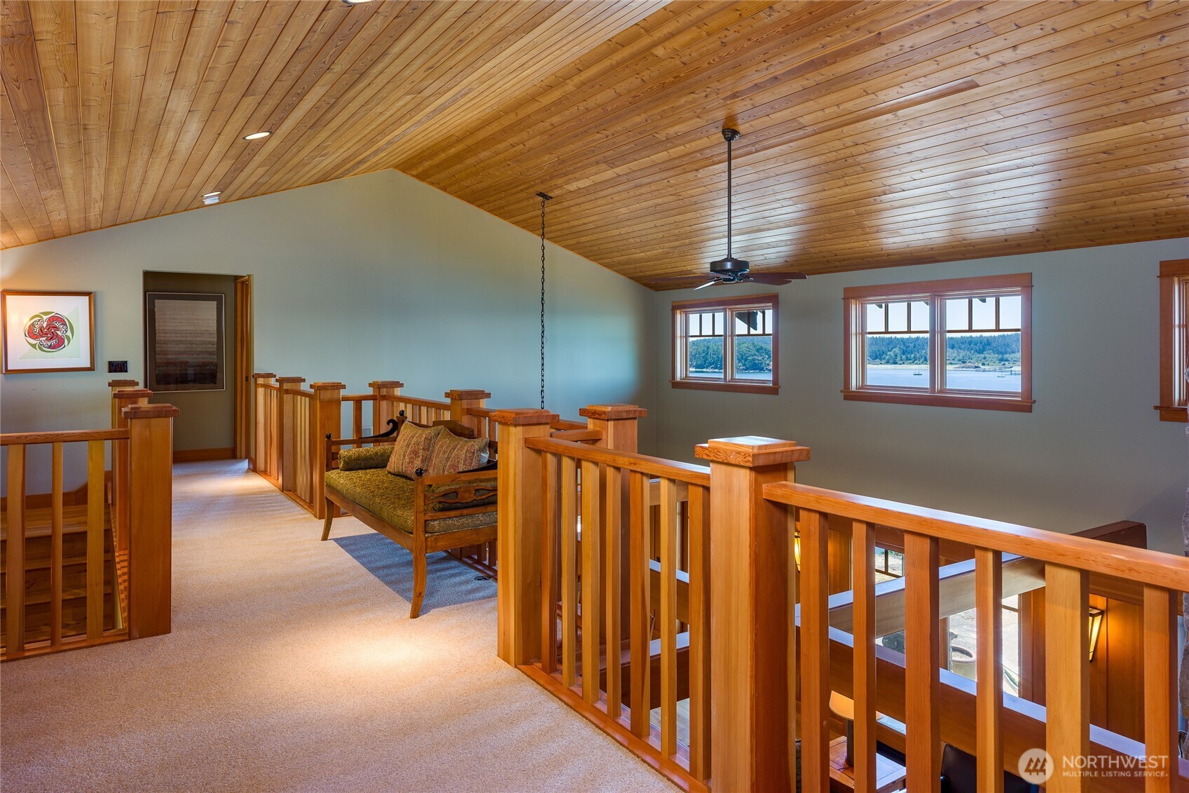 Upstairs there is a balcony overlooking the great room between the second primary ensuite bedroom and guest bedroom.