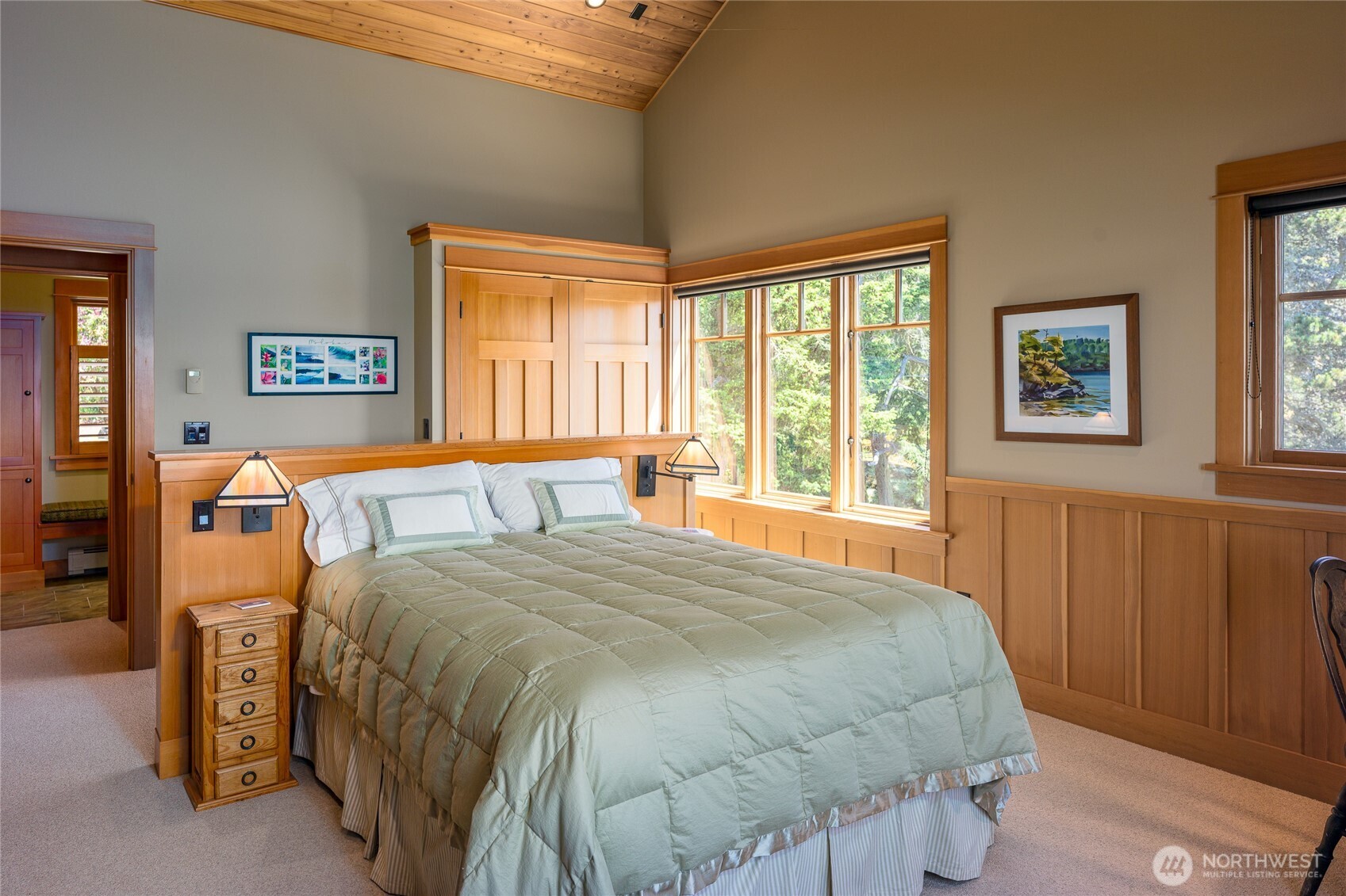 Another view of the third bedroom with a peak into the bathroom.