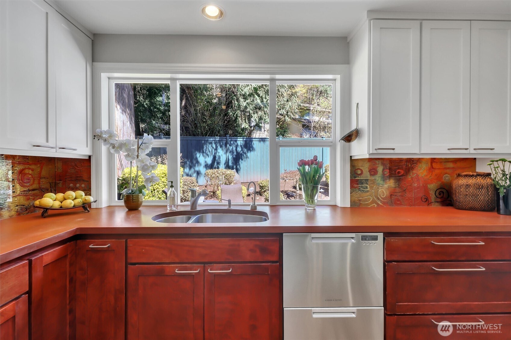 Kitchen looks out to private back yard