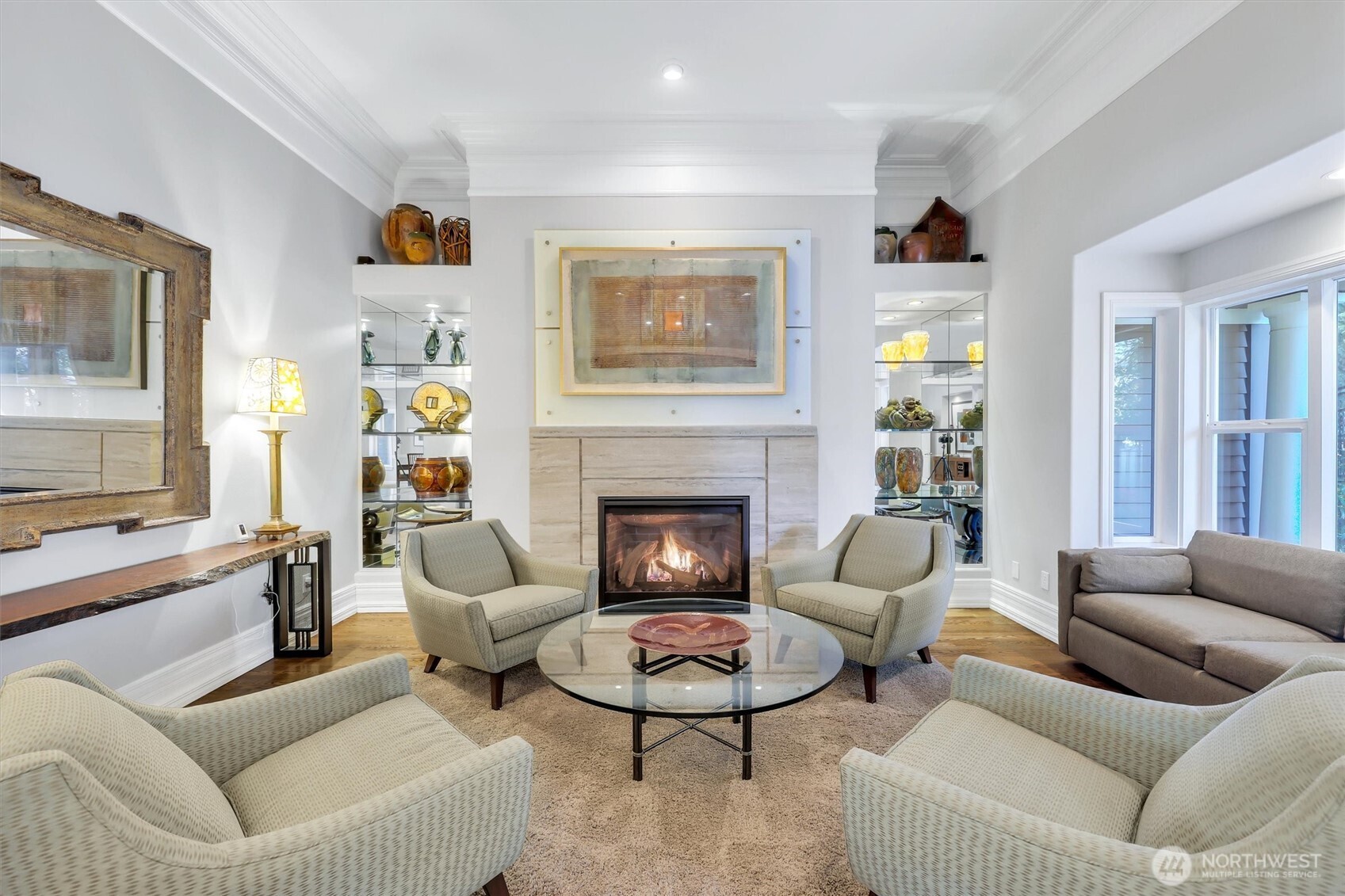 Gas fireplace flanked by custom built ins