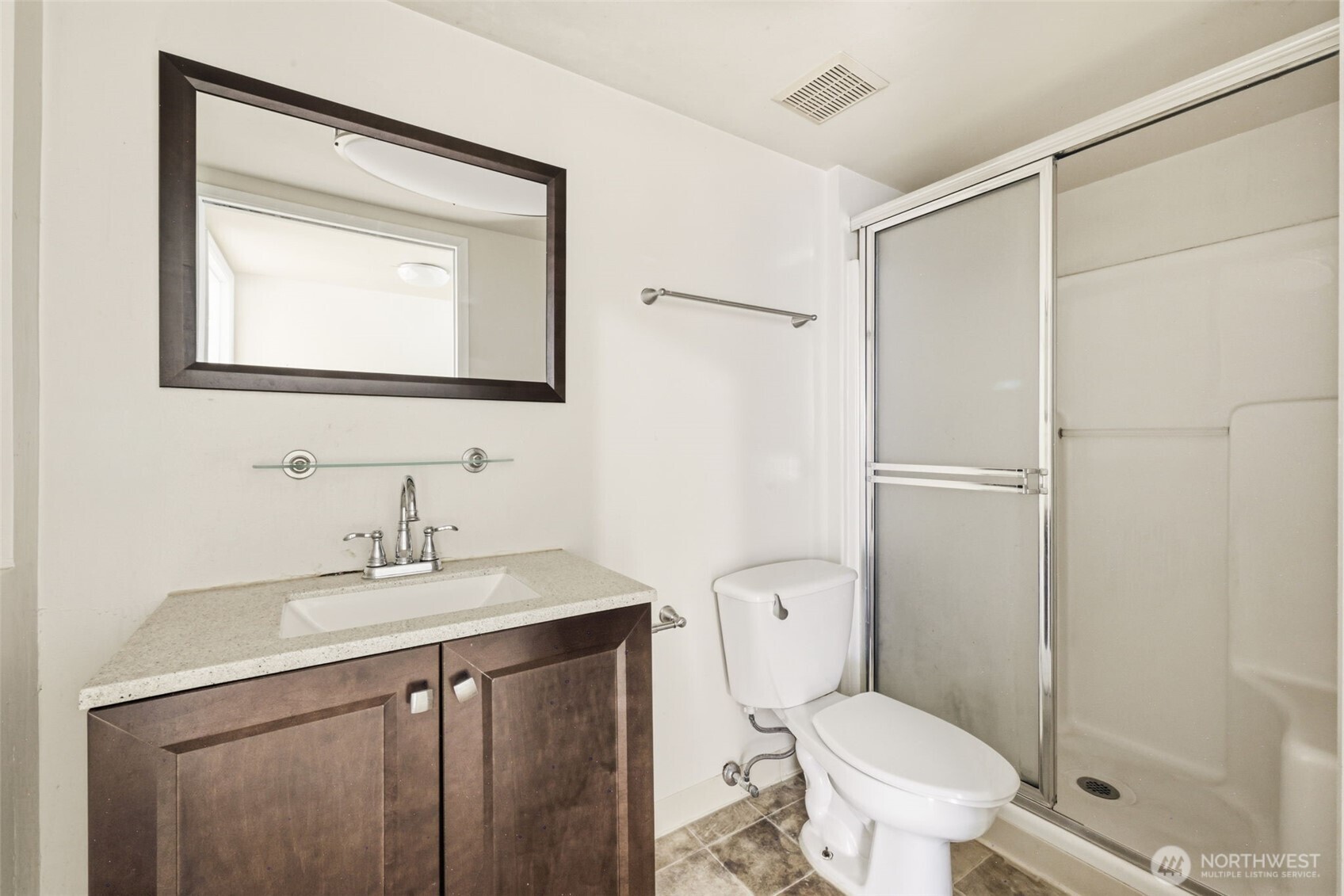 Lower-level bathroom with walk-in shower.