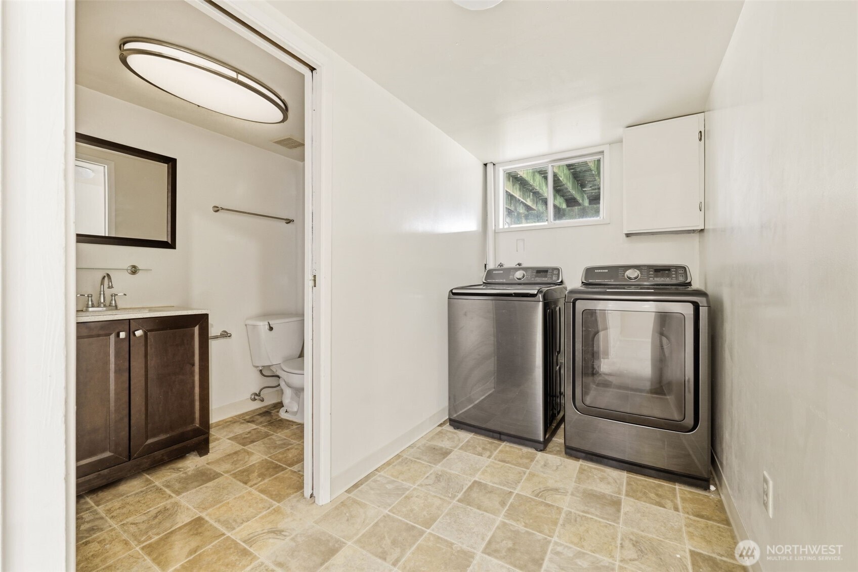 Convenient lower-level laundry room with washer and dryer included.