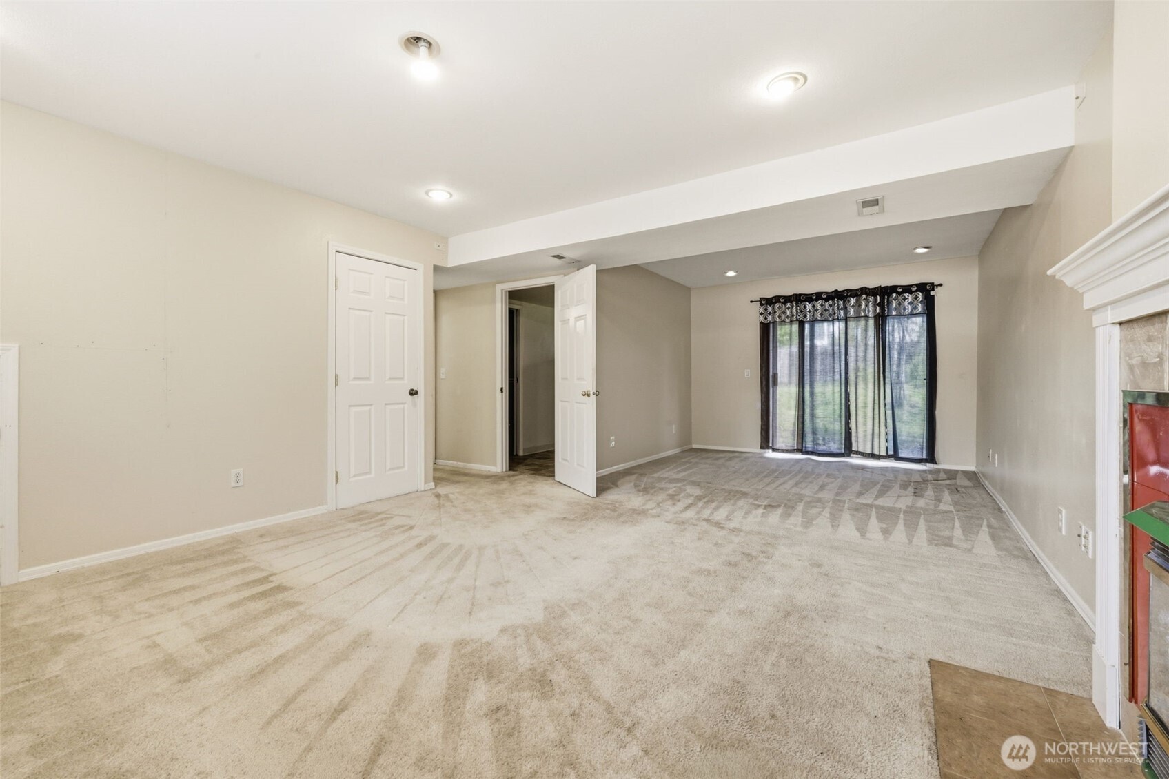 Spacious lower-level bonus area with direct access to the backyard.