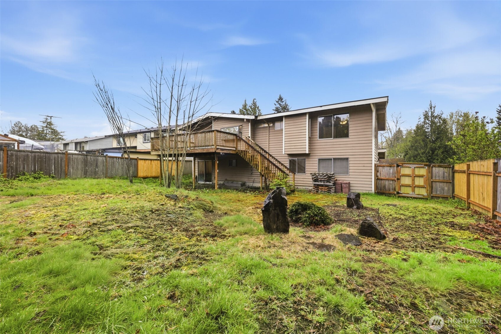 Spacious backyard offering room for outdoor living, gardening, or play.