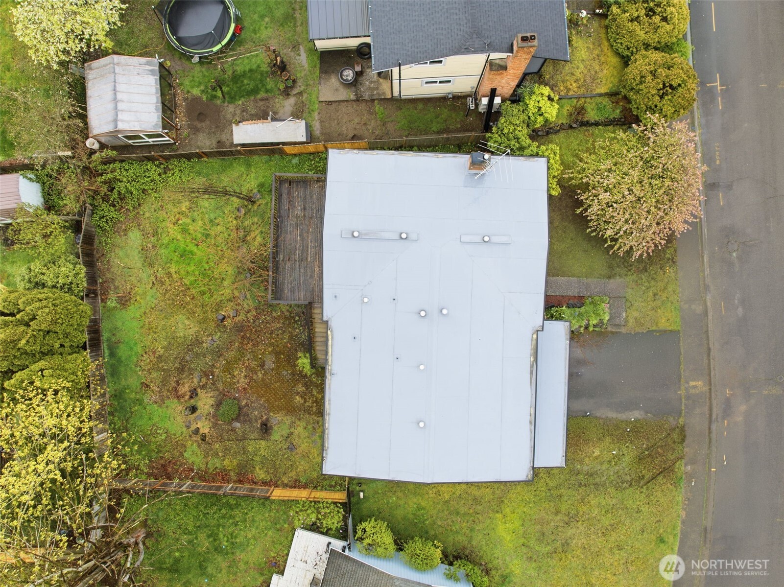 Bird’s-eye view of the property showing the home’s layout and generous lot.