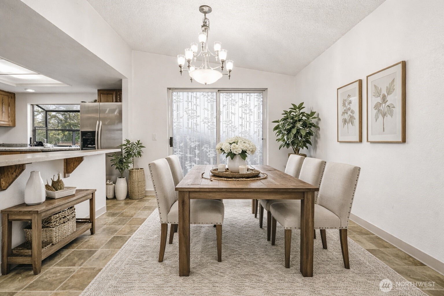 Kitchen with ample cabinetry, generous counter space, and large window bringing in natural light.