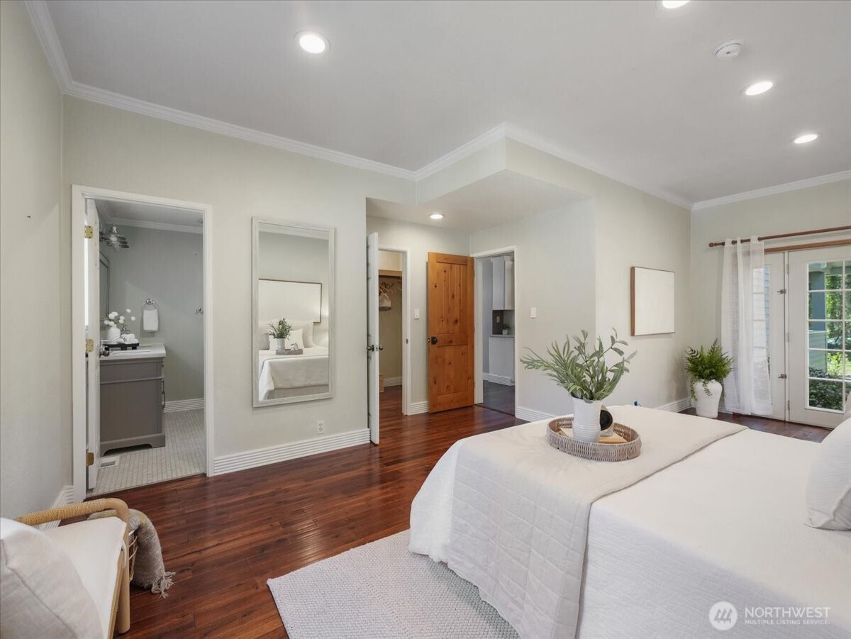 A view from the corner of the primary bedroom. A large en suite and walk in closet.