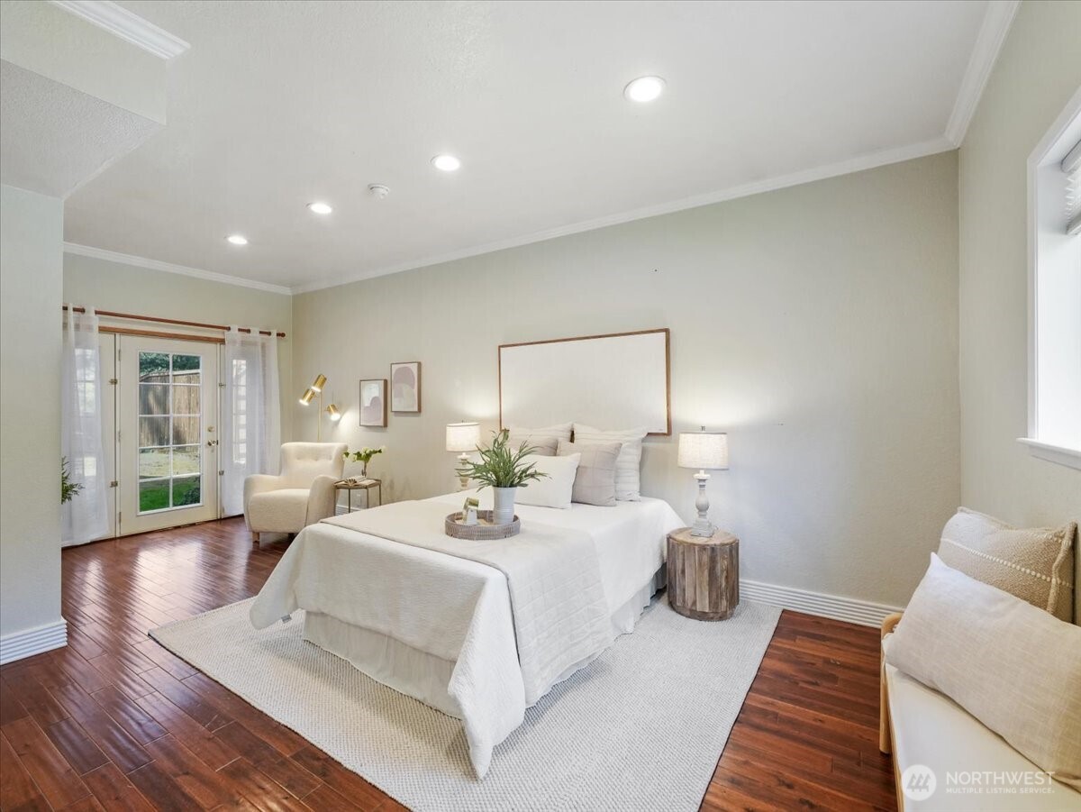 A view of the primary bedroom from the bathroom