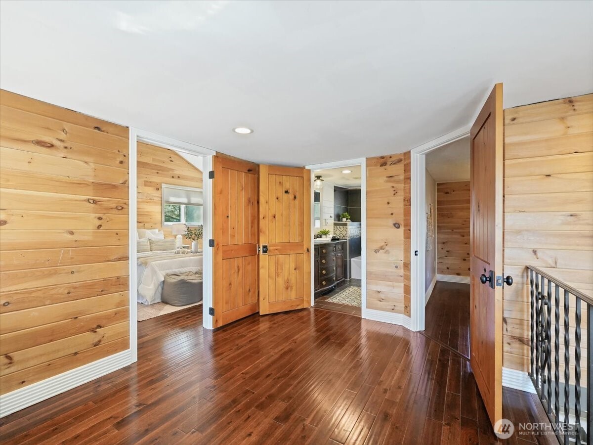 A view from the top of the stairs. You have a full bathroom and 2 bedrooms