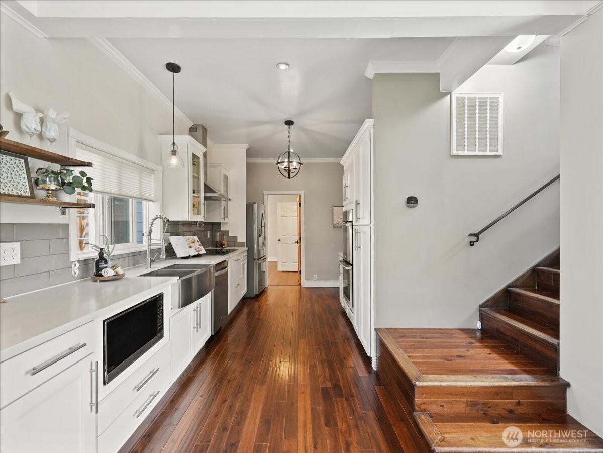 Stairs go up to 2 beds and 1 full bath