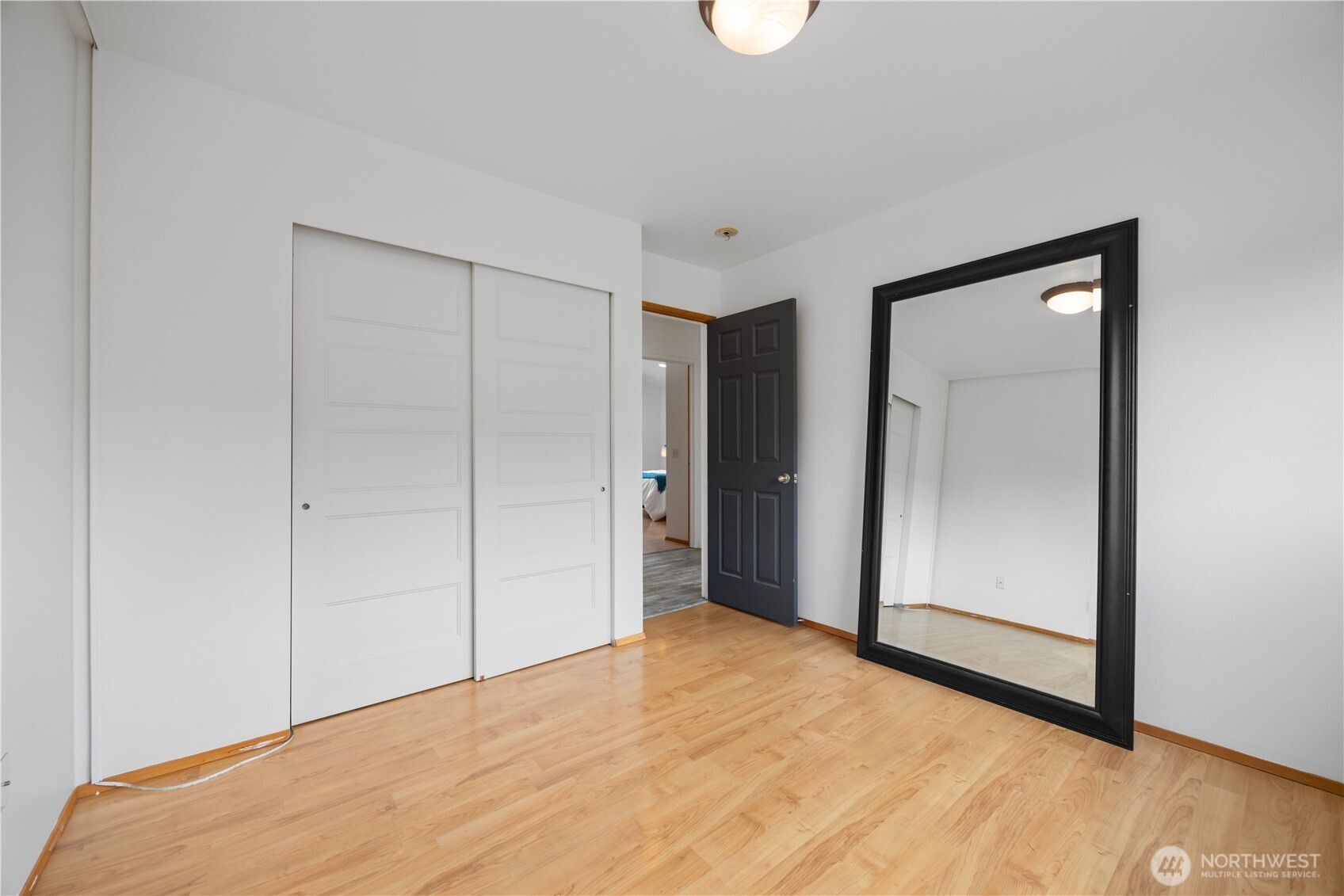 Primary bedroom walk in closet