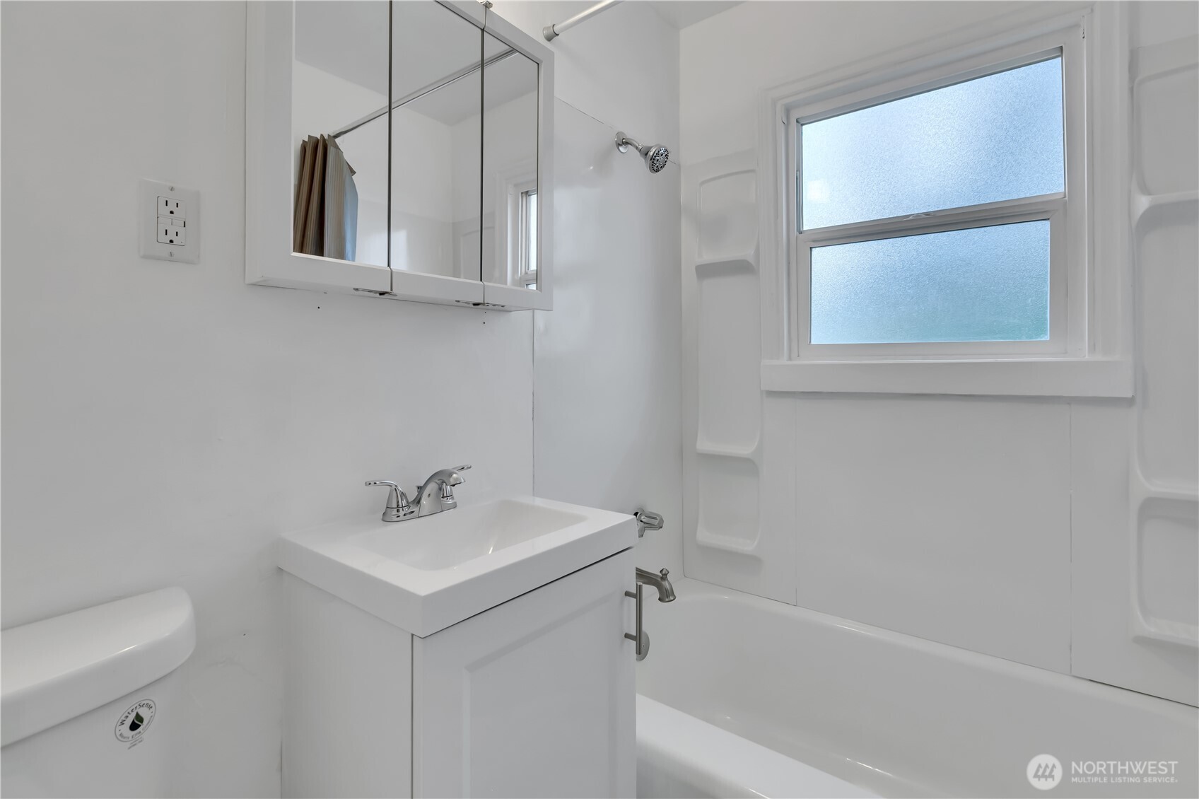 Downstairs bathroom with bathtub/shower combo.