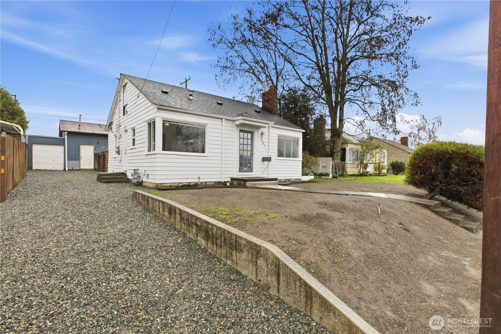 Driveway with access to garage and parking.