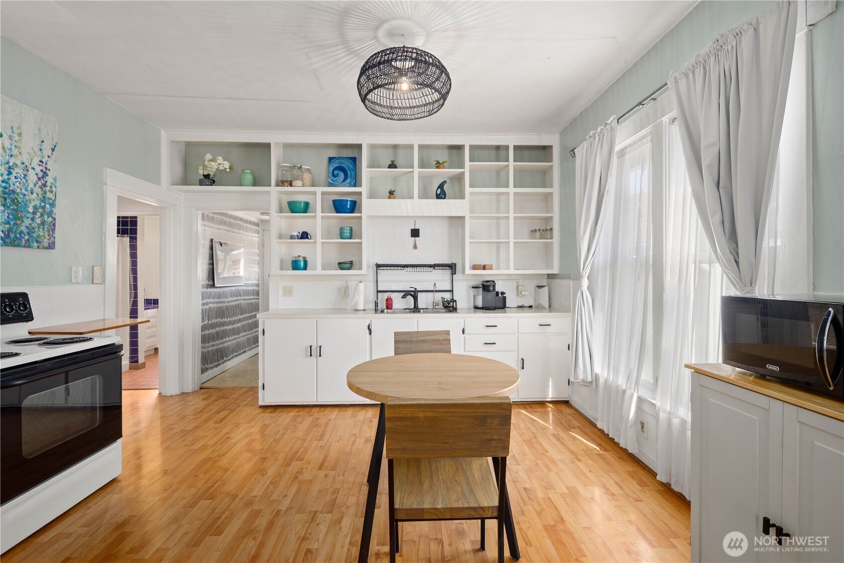 Bright, open kitchen with dining area