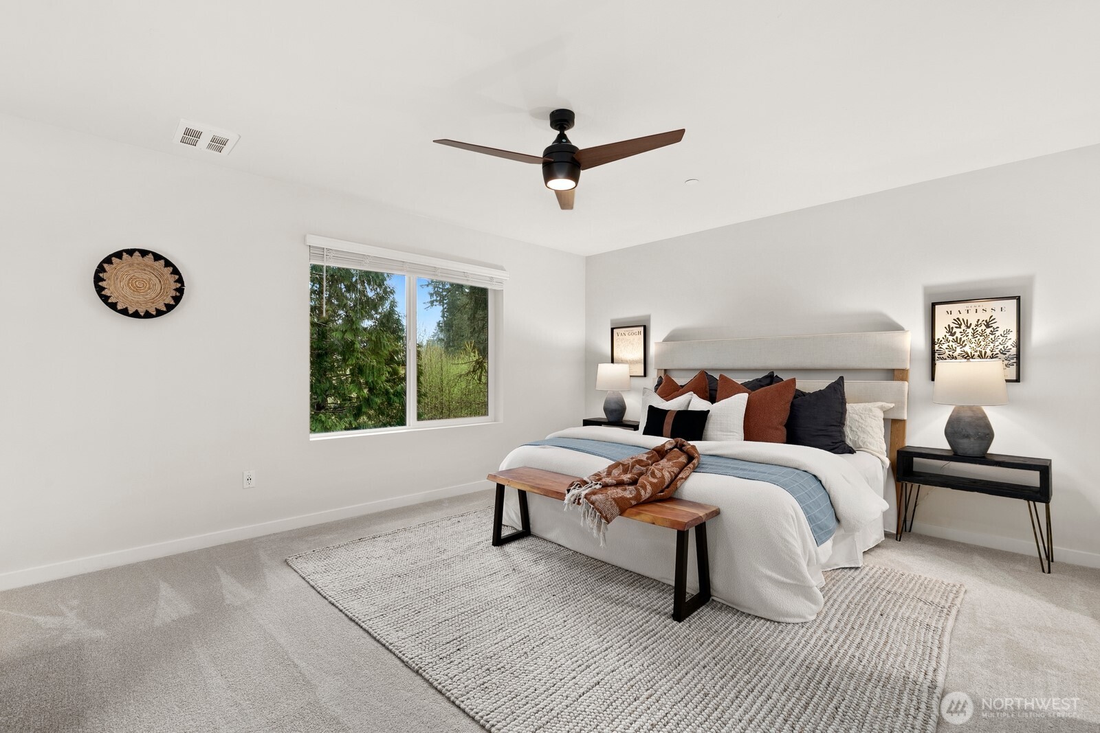 Oversized primary suite sits on upper level at back of unit and enjoys private and peaceful views of greenspace.