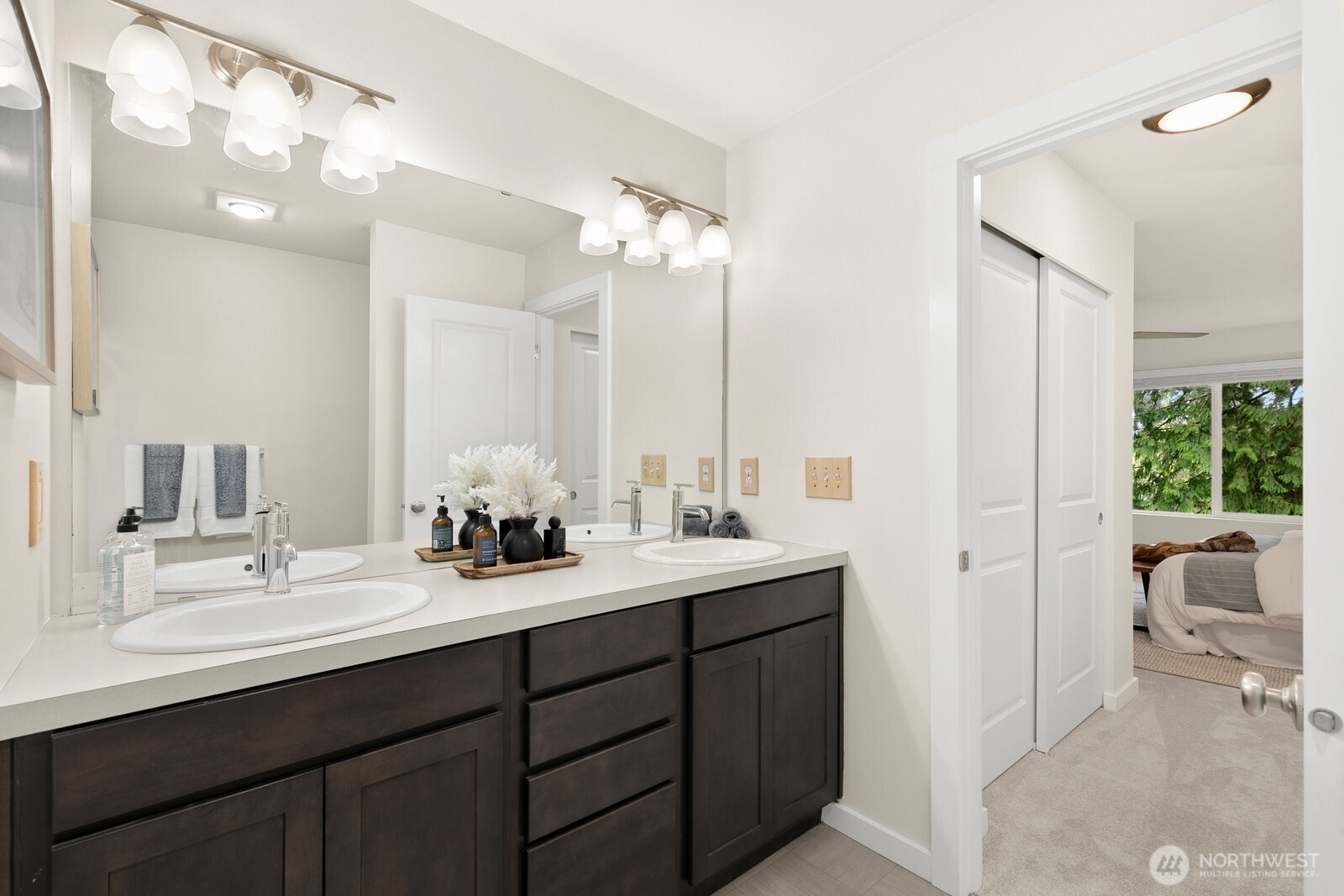 Primary ensuite offers dual vanities and great storage.