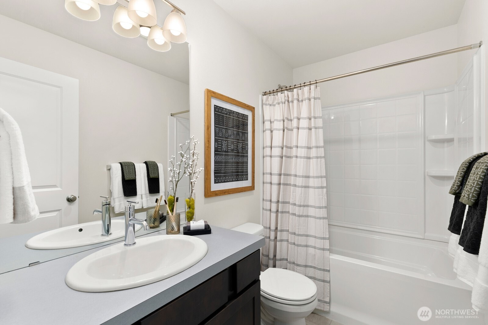 Upper level full bath sits just outside upper level bedroom - allowing each bedroom its own bath!