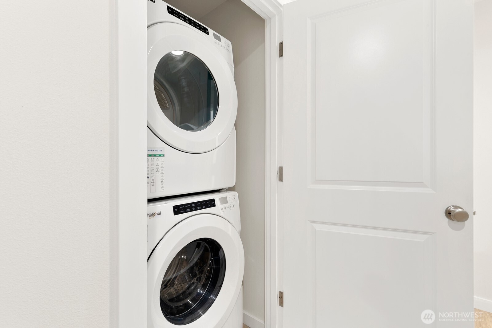 Laundry closet in upper level hallway.