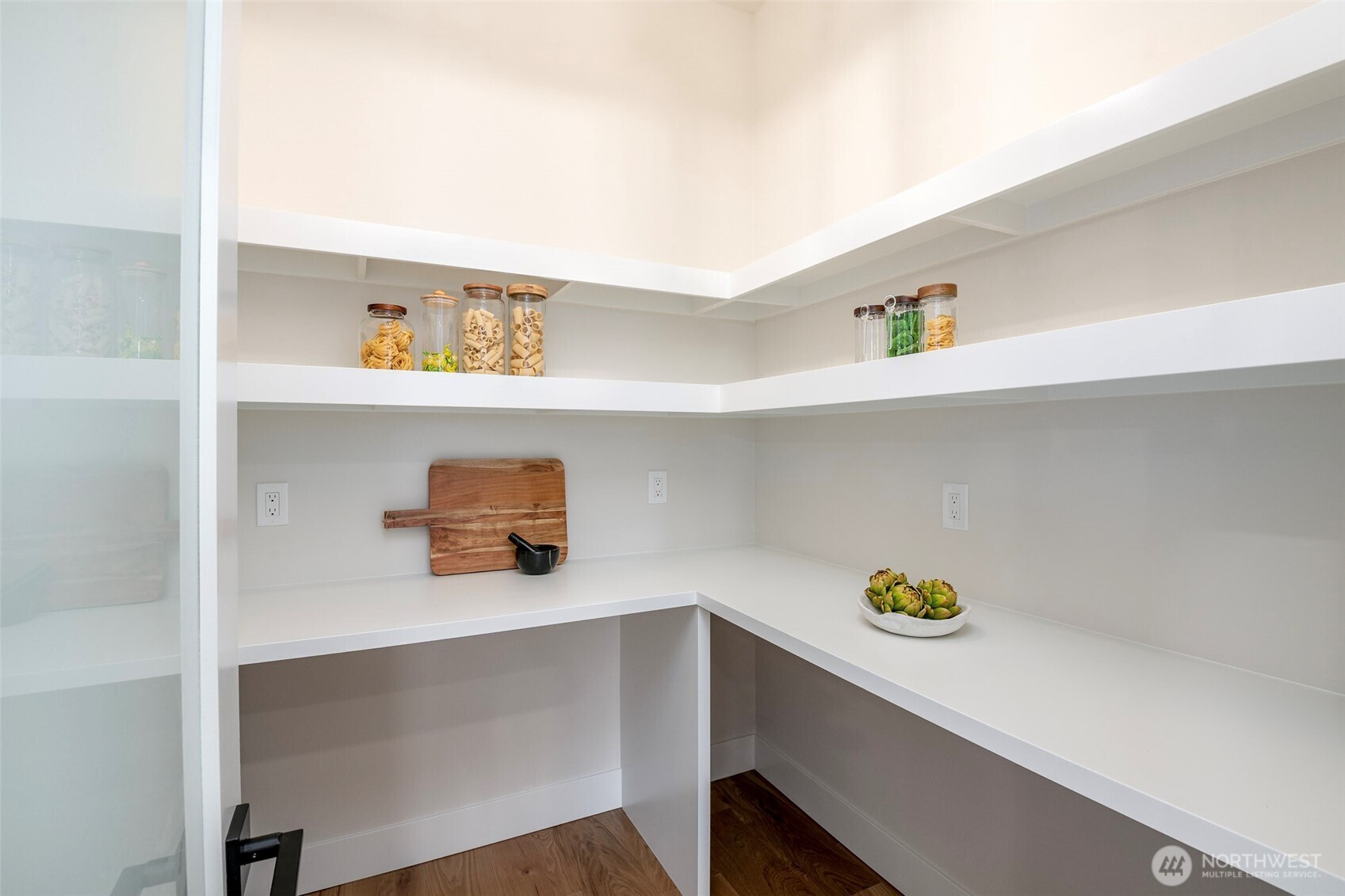 Stylish transition space that has potential for creativity, built in bar space, highlight a custom piece of artwork.