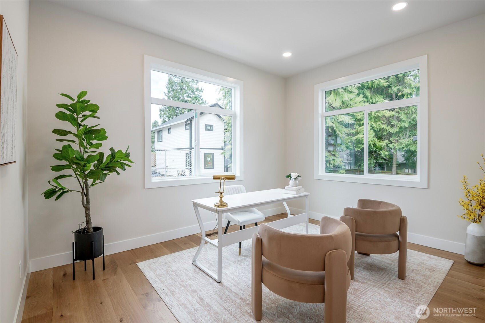 Comfortable main-floor en-suite bedroom with abundant natural light and a private bath, perfect for guests or multi-generational living.