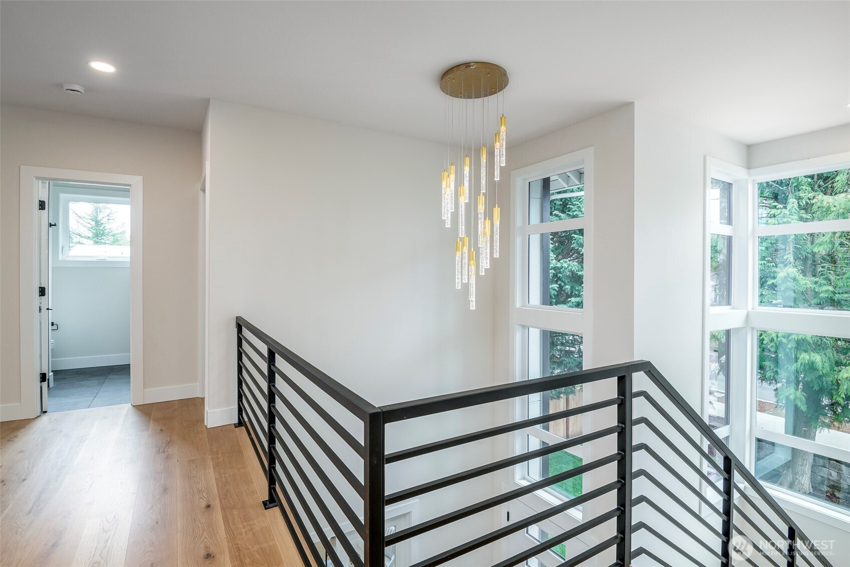 Grand primary suite with double-door entry, private sitting area, and elegant fireplace offering a serene and luxurious retreat.