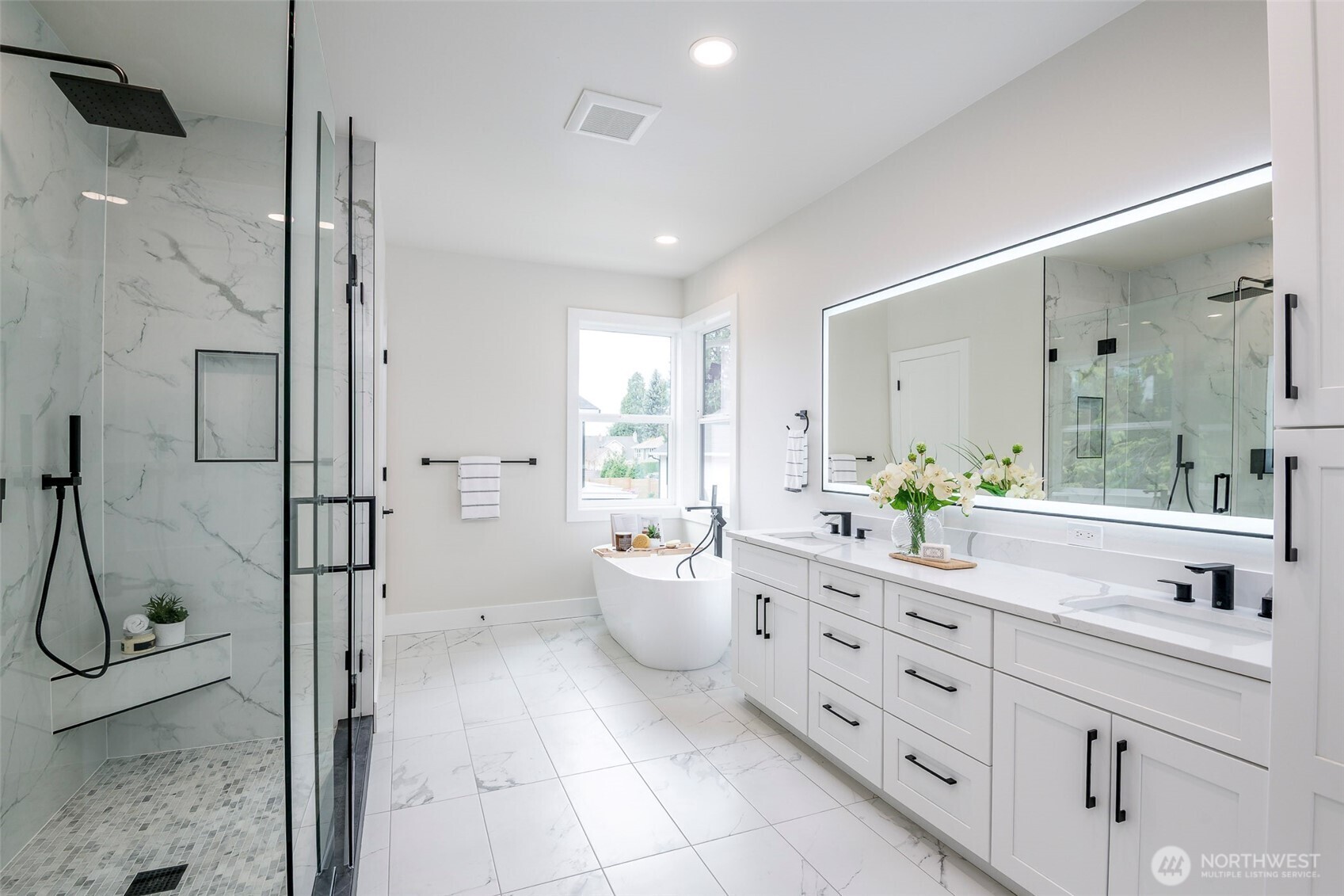 Expansive walk-in Closet with custom built-ins, abundant shelving, and dedicated storage for optimal organization. Connecting to the utility room for an easy lifestyle flow.