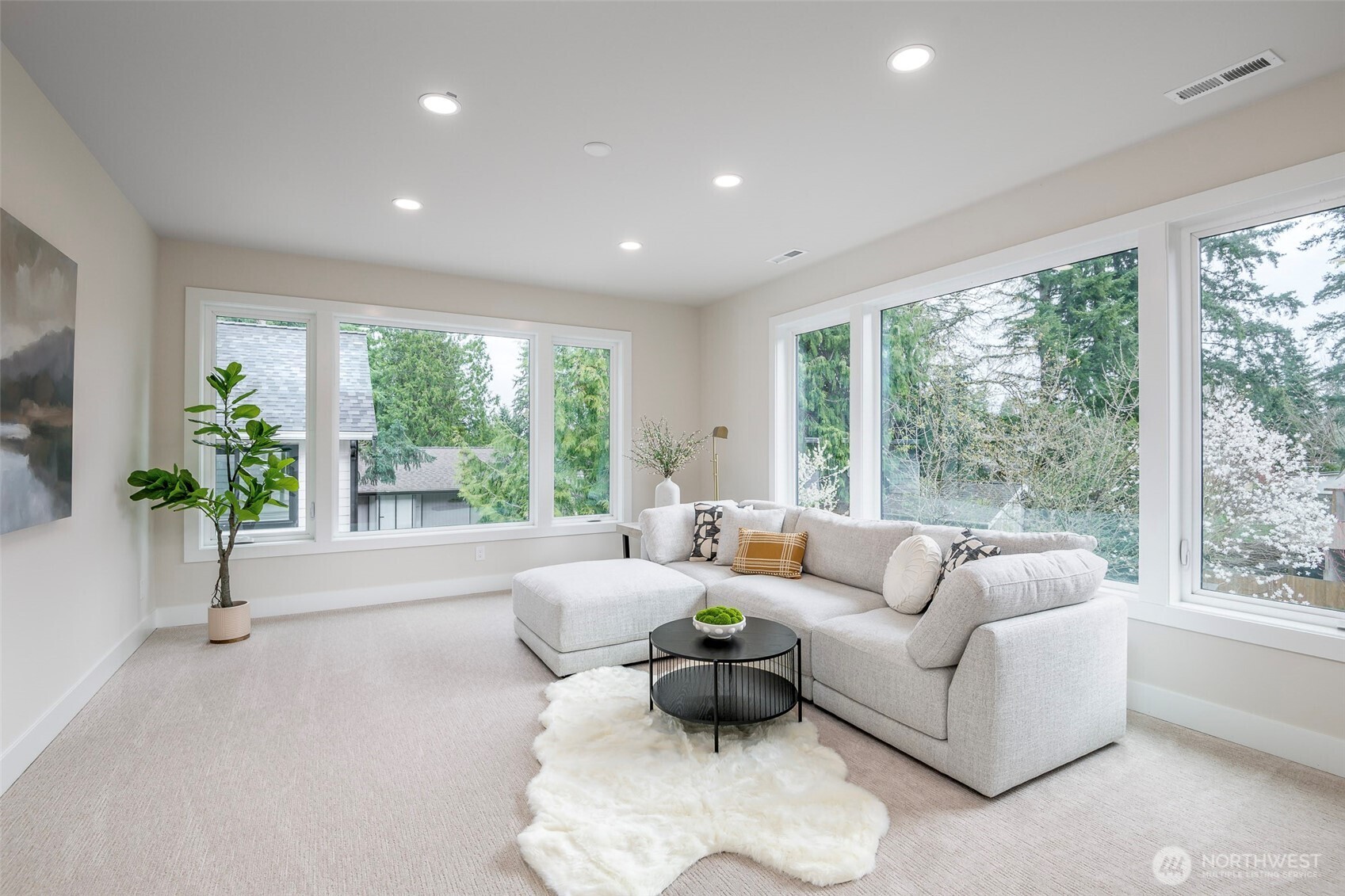 One of four second floor bedrooms featuring southern exposure view and loft height ceilings.