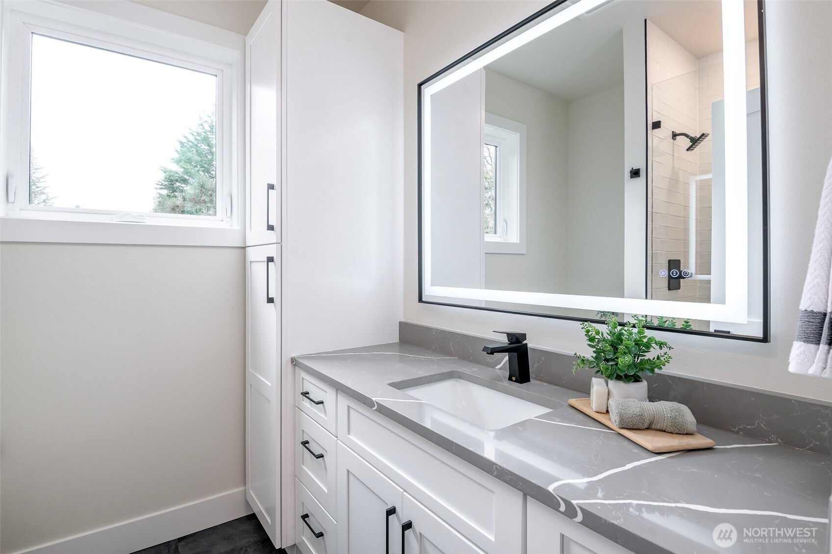 Third bedroom on the second floor tucked back from the others. Looks out onto the front mature landscape.
