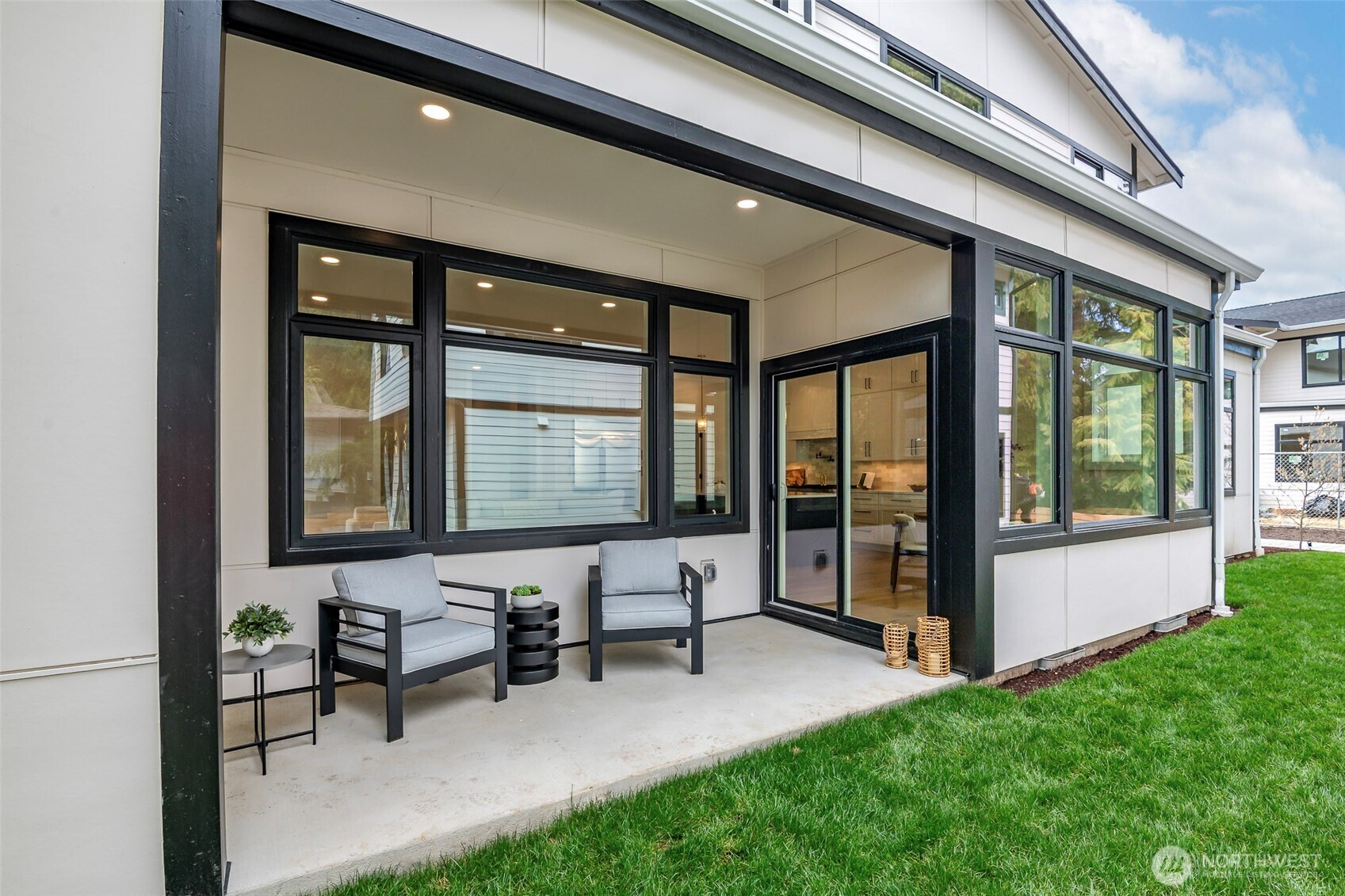 Paver driveway and parking pad with clean modern hardscaping, offering easy access to a private lighted path leading to the DADU.