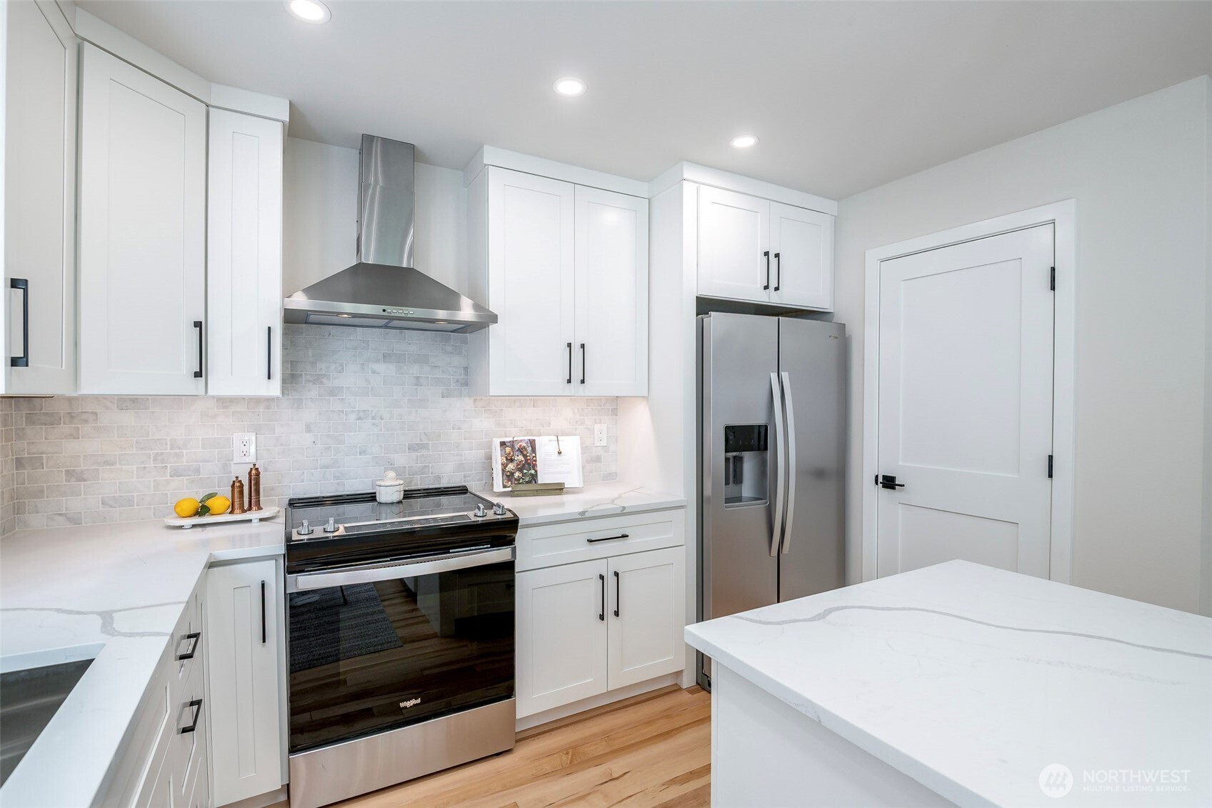 Stainless steel appliances and generous counter top space.