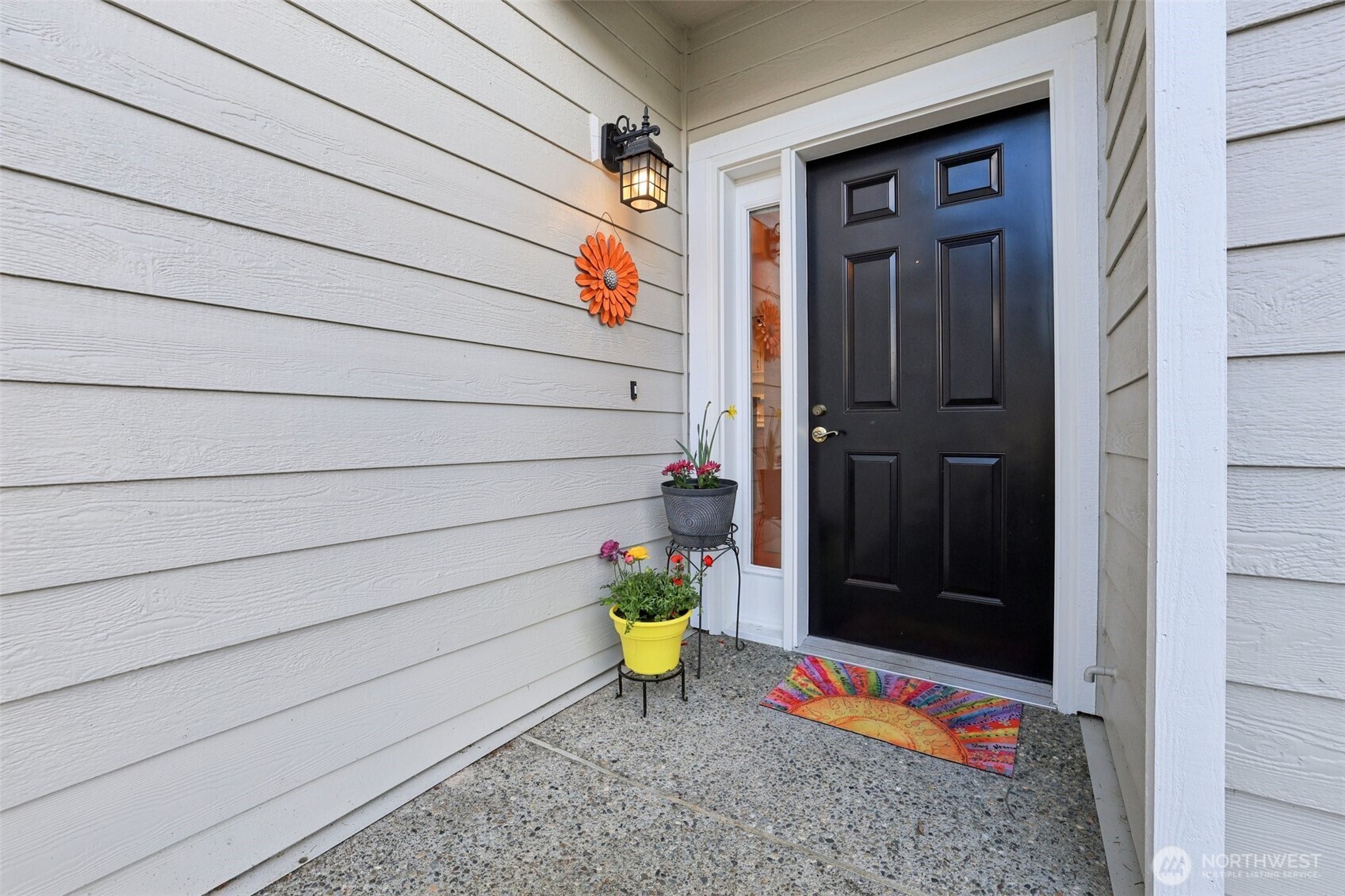 Welcoming front door with area for planted pots