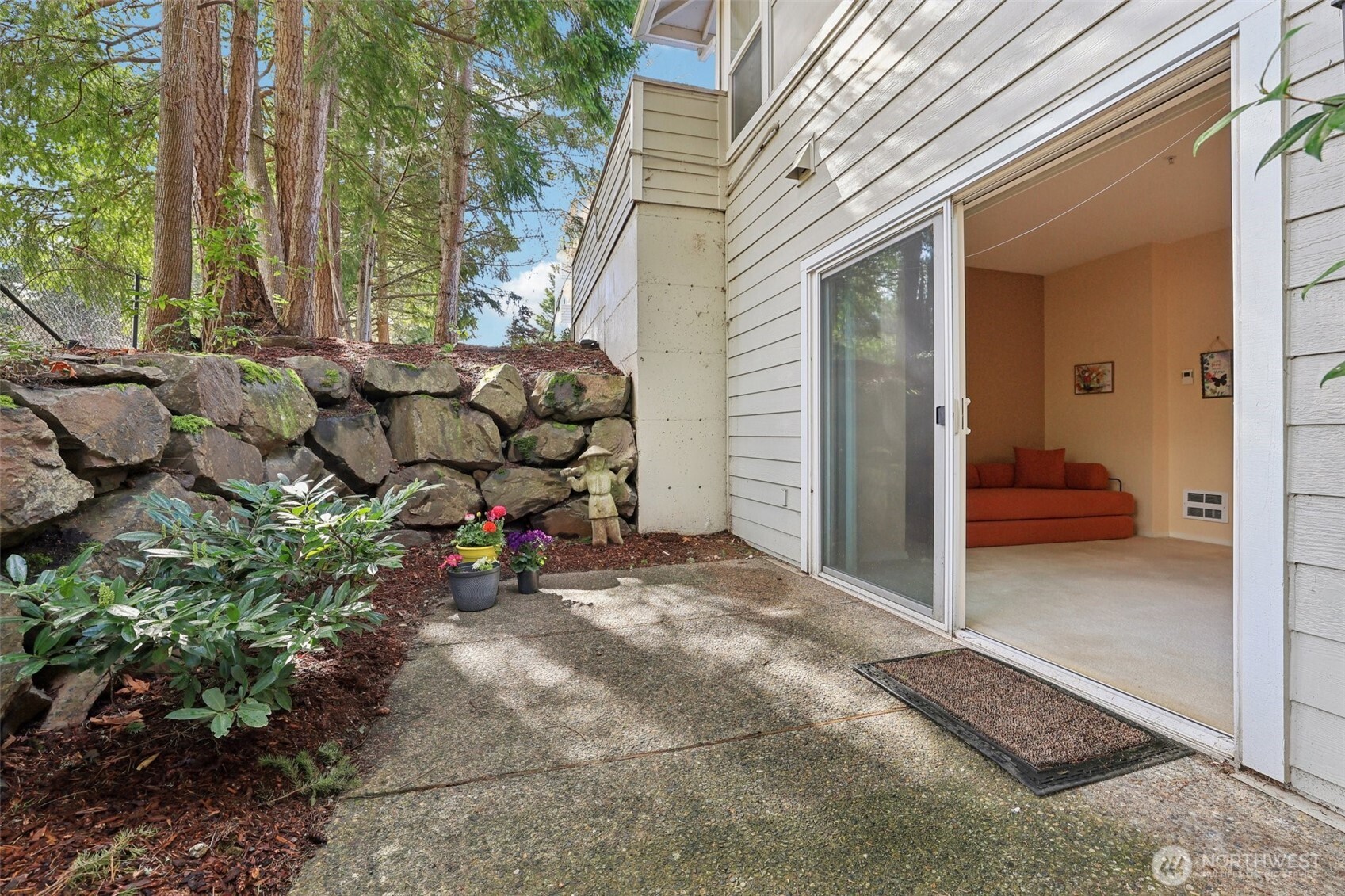 Side Patio with a pathway around to the front of the condo