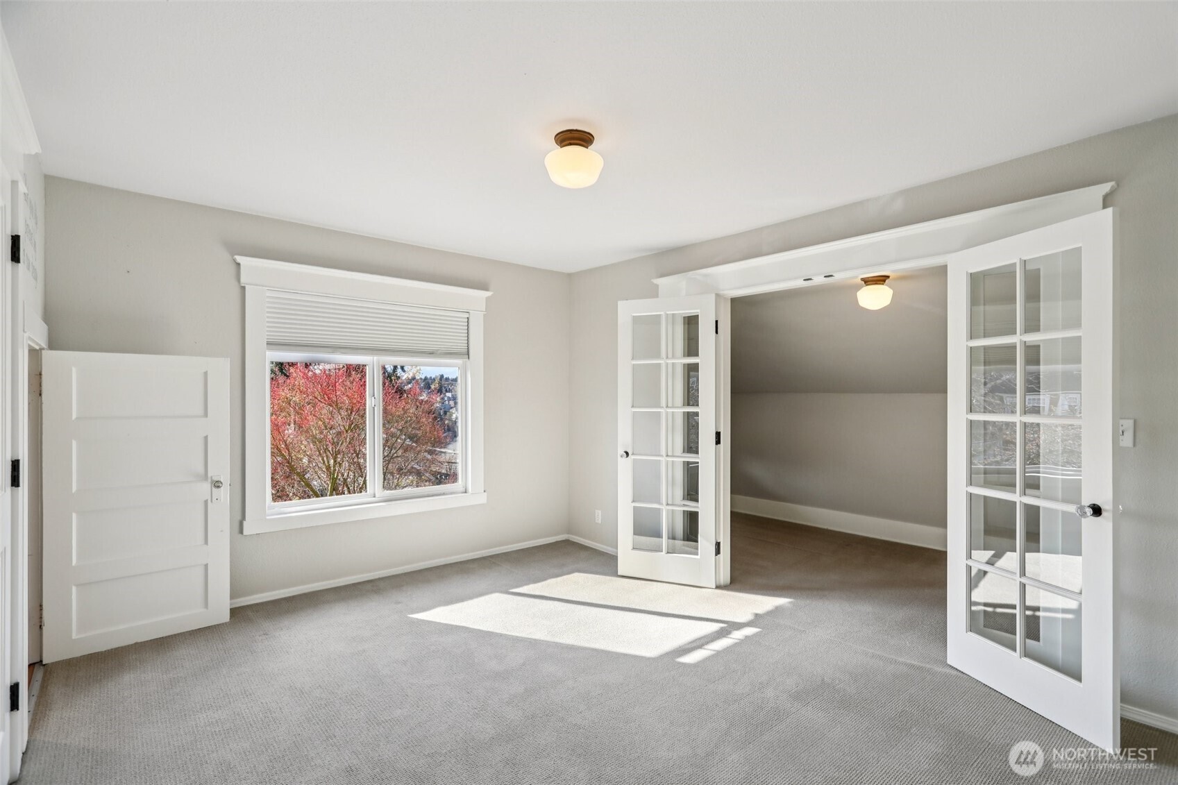 West facing bedroom with additional space - what you see beyond French doors is NOT the closet but could be if you wanted.
