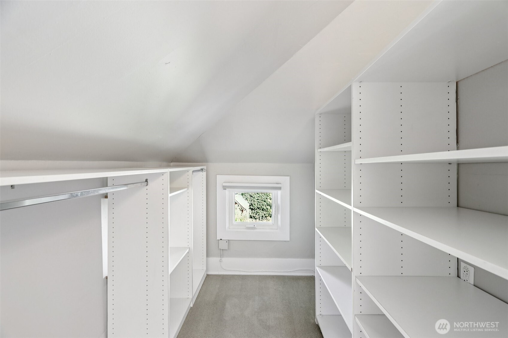 plumbing for washer/dryer behind shelves to the right
