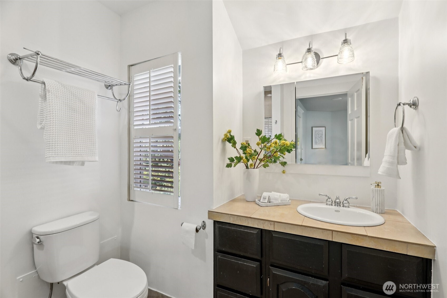 three-quarter bath attached to primary bedroom (shower behind)