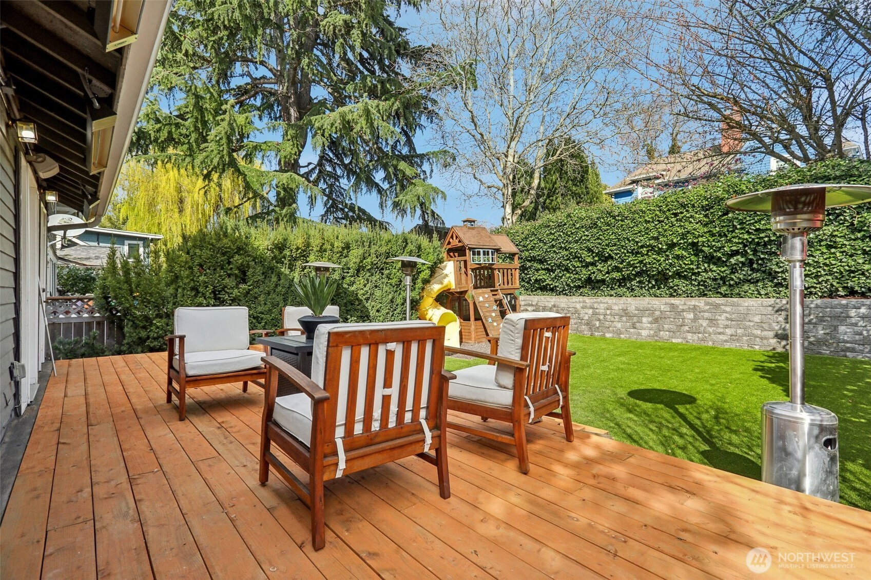 private, level, sunny, and spacious! Play structure included!