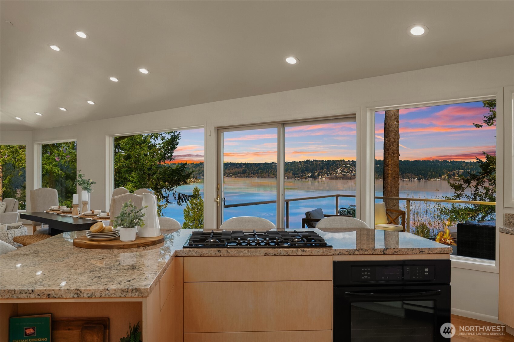 Gas cooktop and large center island with seating.