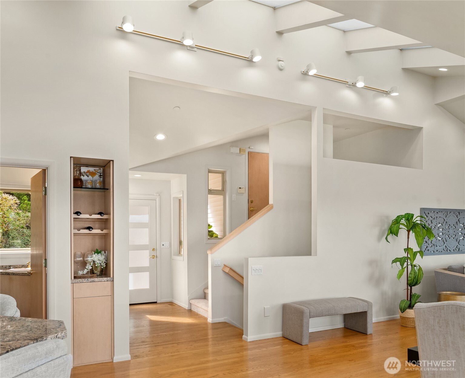 Soaring ceilings and skylights create volume and a sense of ease.