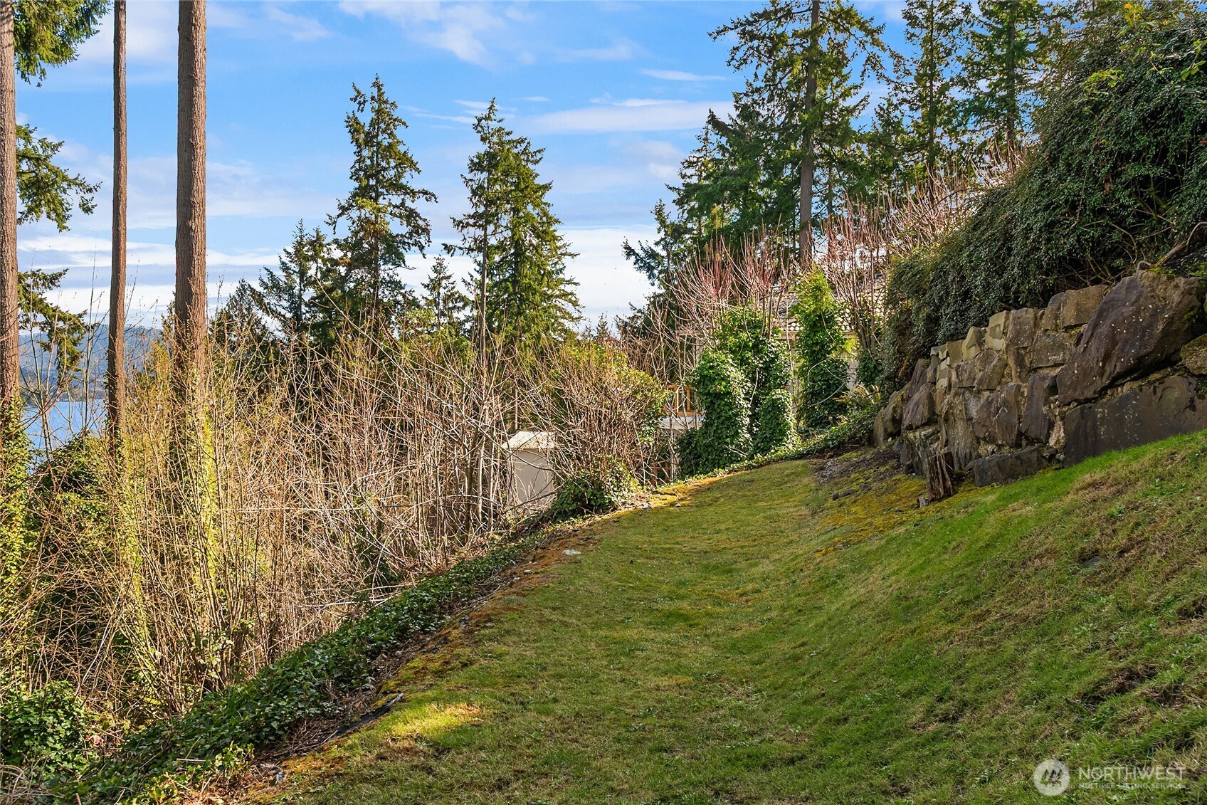 Side yard with invisible fence system for pets.