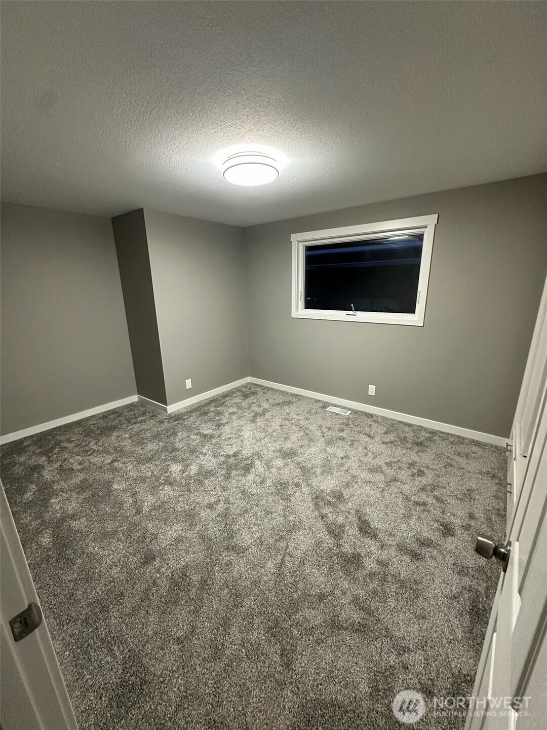 Bedroom with window facing north side