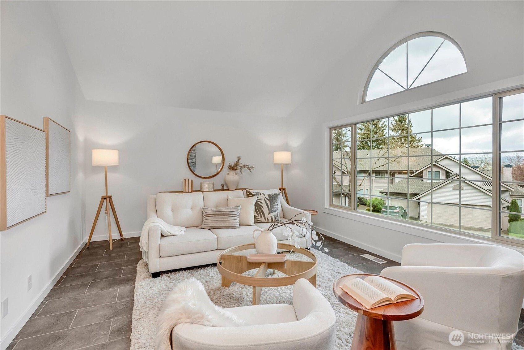 Vaulted ceilings, walls of windows....custom tile flooring and freshly painted. The living room is a room you are sure to love!