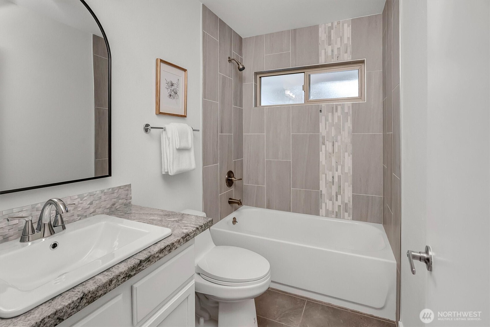 2nd/Guest bath is perfectly remodeled to reflect the same quality as the other rooms of the home. Custom tile, lighting, fixtures....and paint! Move-in ready!