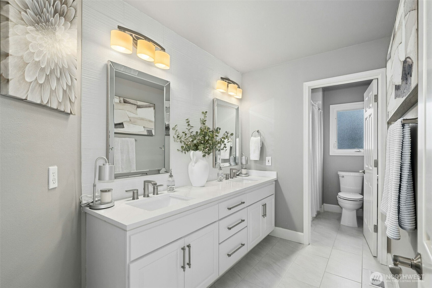 Refined, contemporary bath with a calm, nuetral palette.