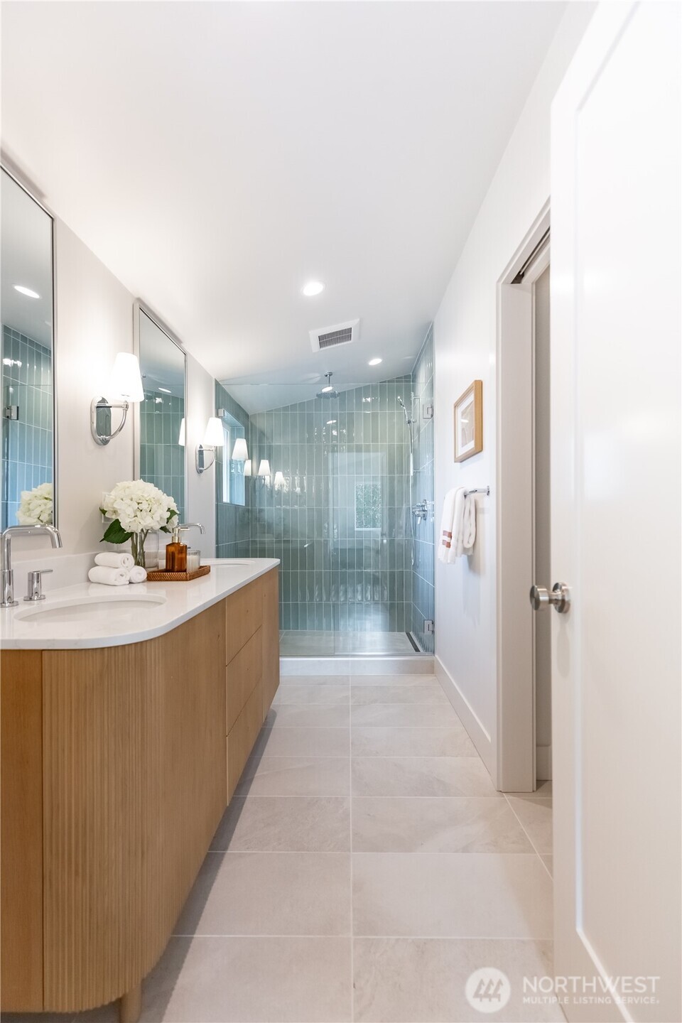 Primary bath with water closet entry to the right.