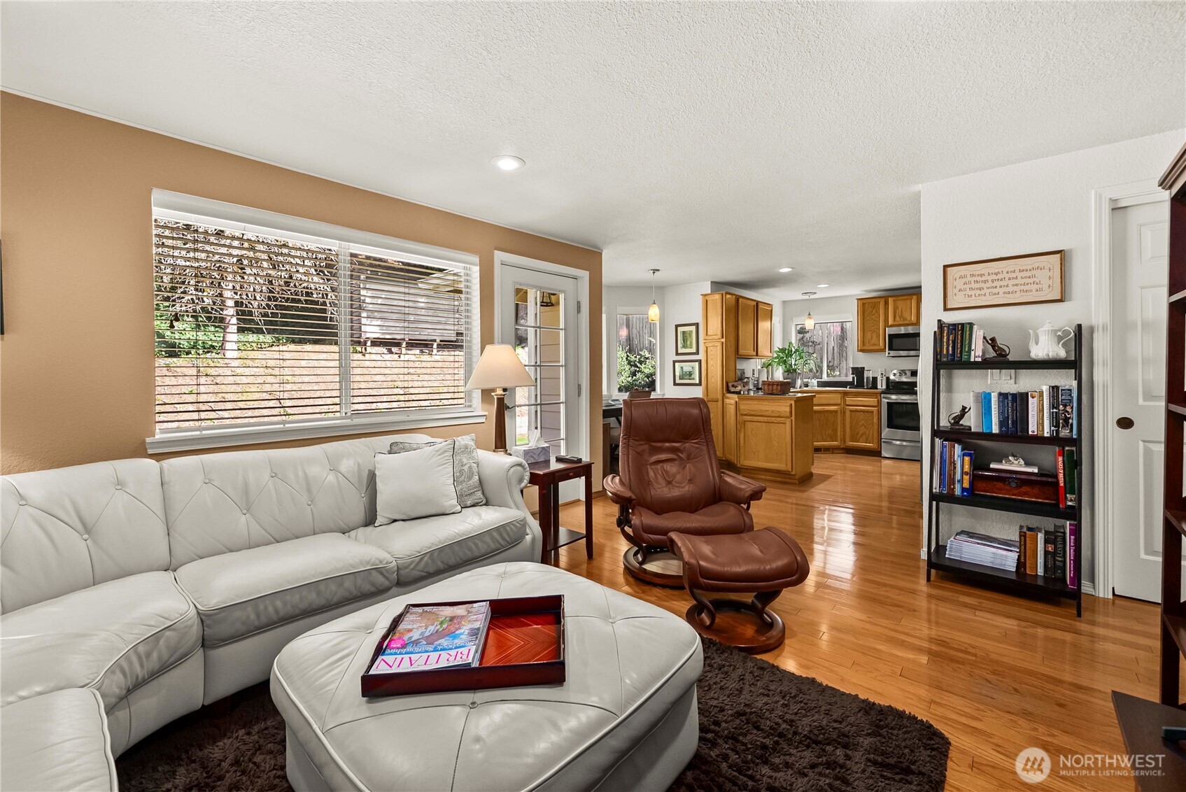 The breakfast nook is currently used as a personal office, with bay windows and a view of the backyard.