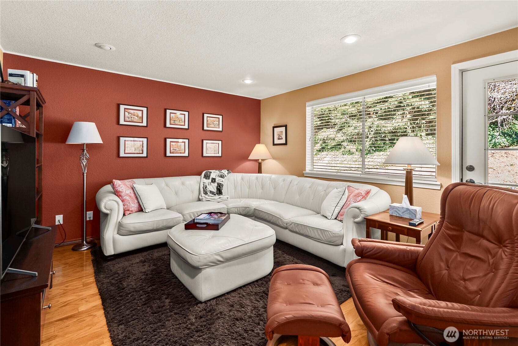The spacious family room is open to the kitchen and breakfast nook, and features those gorgeous hardwood floors.