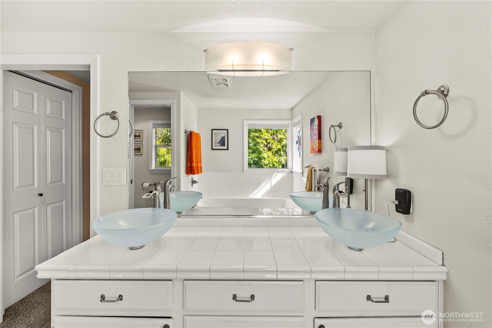 Double Vessel Sinks and Tile countertops in the Primary bath