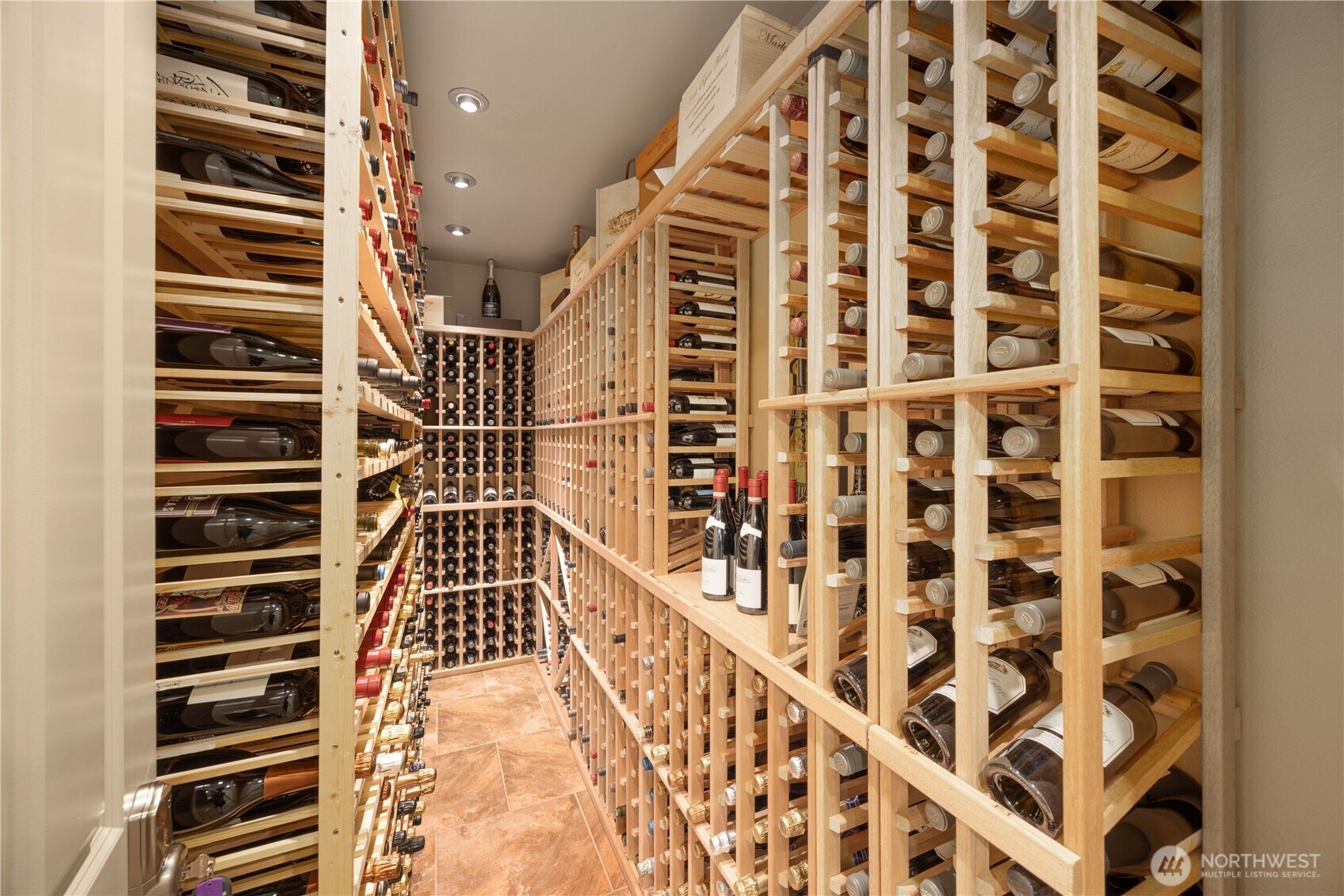 "Bring or start a wine collection. With space for 900+ bottles this wine room is perfect."