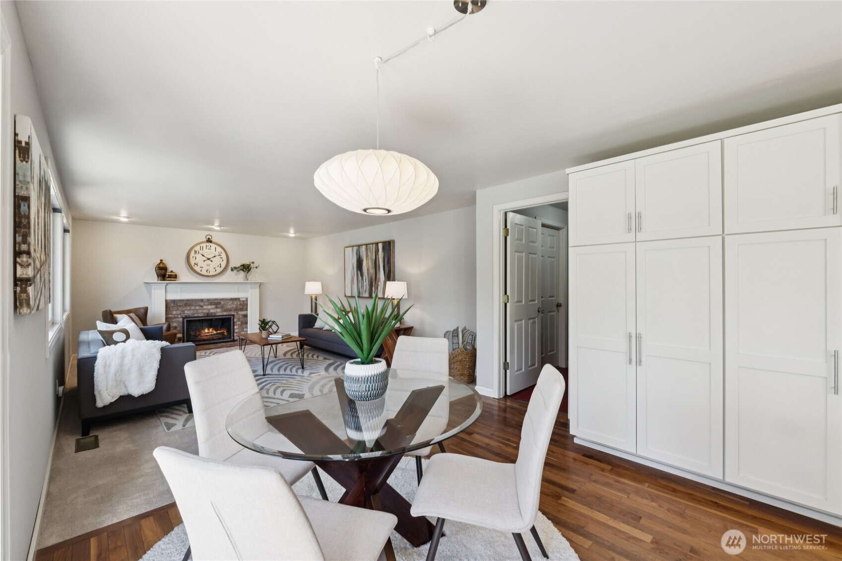 The dining area sits right off the kitchen. Check out the wall of cabinetry, and all of the open spaces—it's so simple, so practical, and so well thought out.